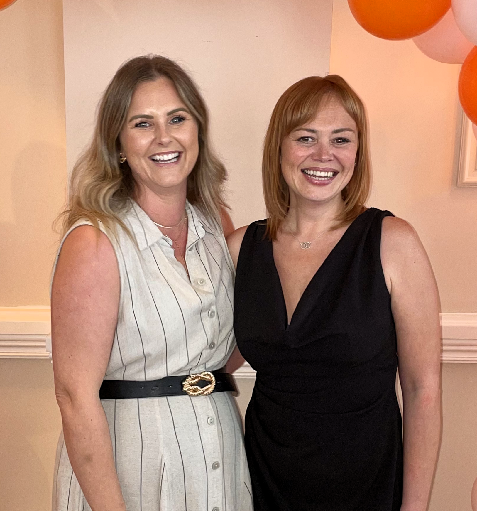 Emma and Liz from Smile Education's Permanent Recruitment team looking at the camera and smiling