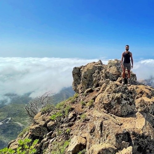 North-West Director Kash stood on top of a hill